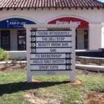 Monument post and panel for shopping mall