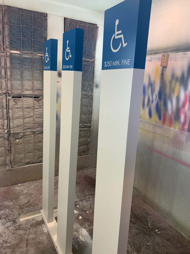 ADA parking Lot Signs in Paint Booth